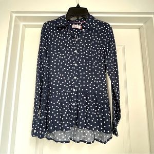 Navy blue polka dot shirt.